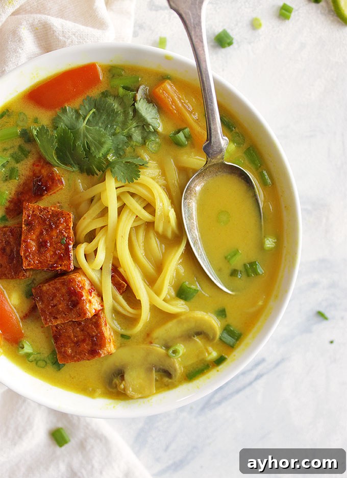 Crispy Tofu Thai Curry Soup Recipe: Flavorful Coconut Broth 6 Thai curry soup, sauteed mushrooms, bell peppers, onions, and rice noddles in a creamy curry broth. And topped with crispy tofu. Only takes 30 minutes to make, the perfect weeknight dinner recipe, especially in the winter! (Vegan, Gluten Free, Vegetarian) | robustrecipes.com
