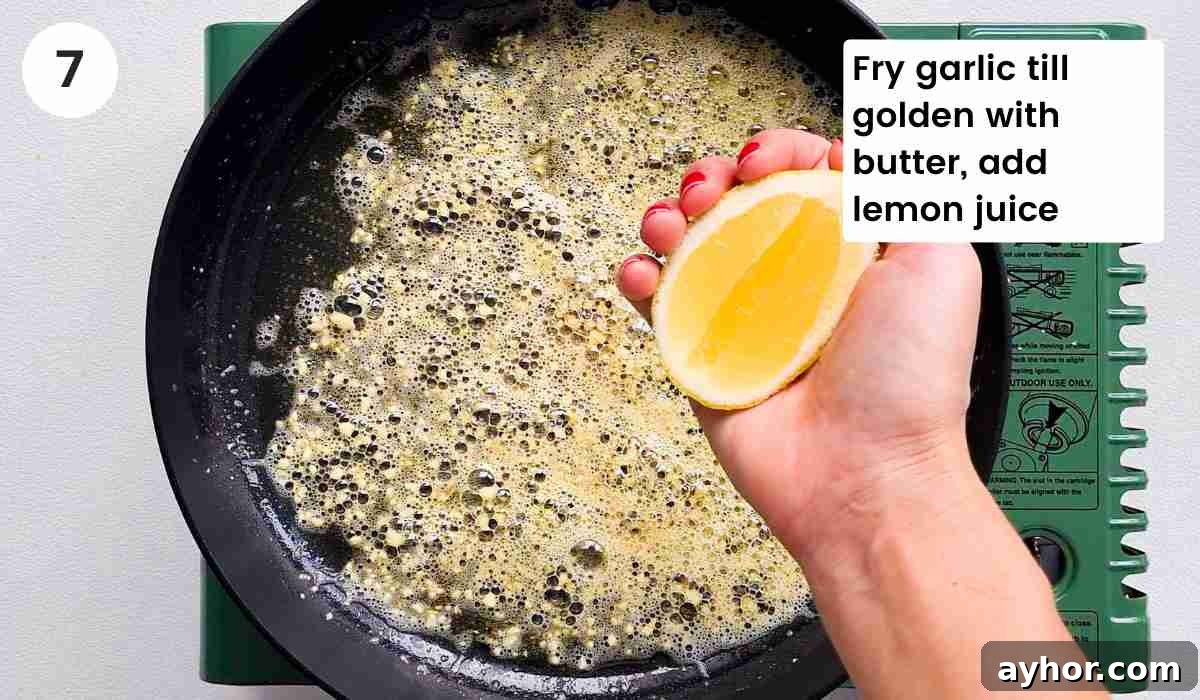Creamy Lemon Garlic Butter Pasta Recipe for Quick Weeknight Meals 11 Lemon juice being squeezed into a pan of melted butter with caption