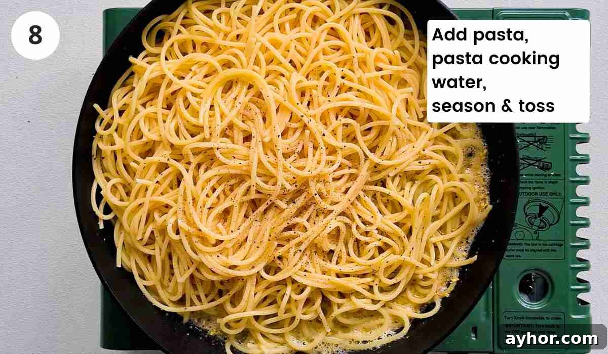 Creamy Lemon Garlic Butter Pasta Recipe for Quick Weeknight Meals 12 Cooked spaghetti inside a frying pan with caption