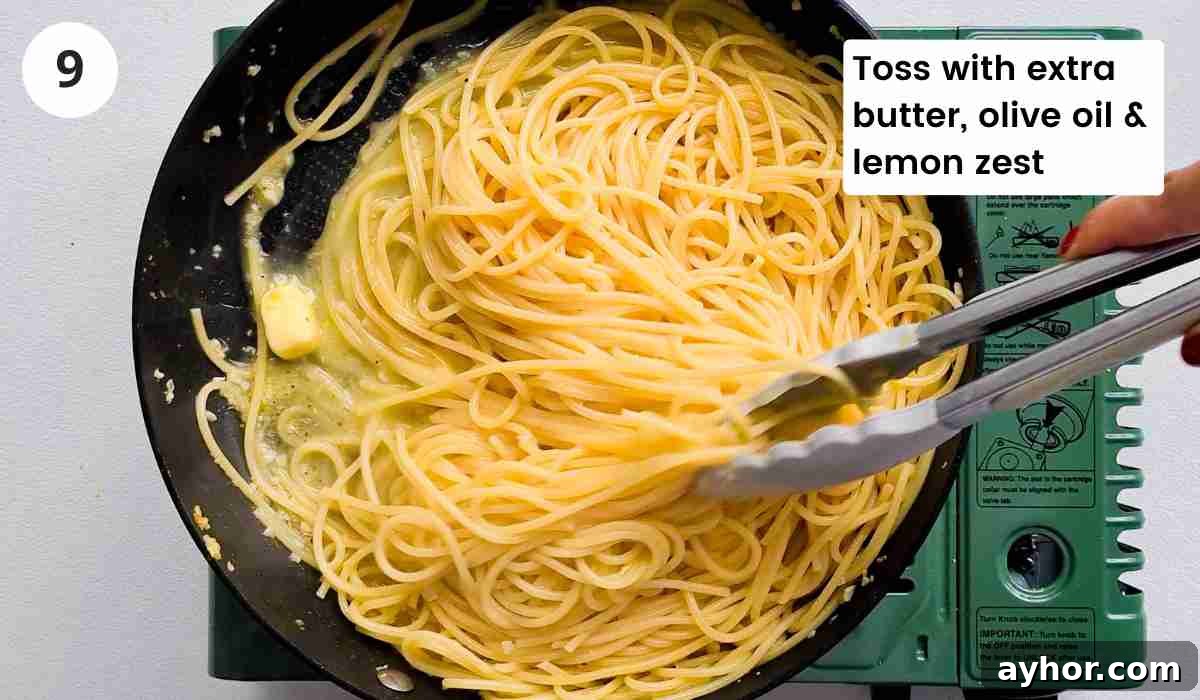 Creamy Lemon Garlic Butter Pasta Recipe for Quick Weeknight Meals 13 Spaghetti being tossed in garlic butter sauce with caption