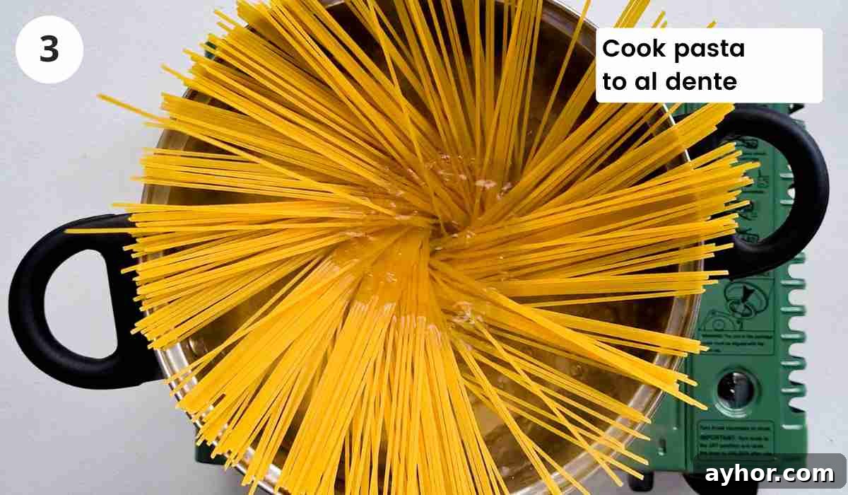 Creamy Lemon Garlic Butter Pasta Recipe for Quick Weeknight Meals 6 Spaghetti being cooked boiled with caption