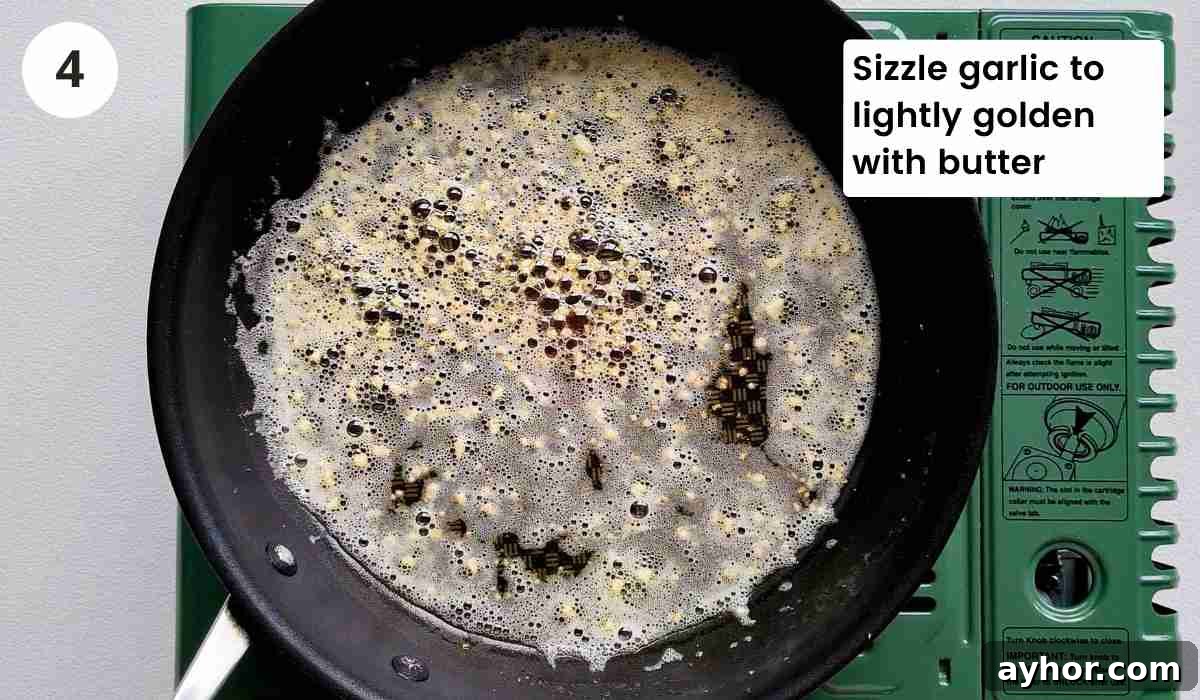 Creamy Lemon Garlic Butter Pasta Recipe for Quick Weeknight Meals 7 Minced garlic being fried in butter with caption