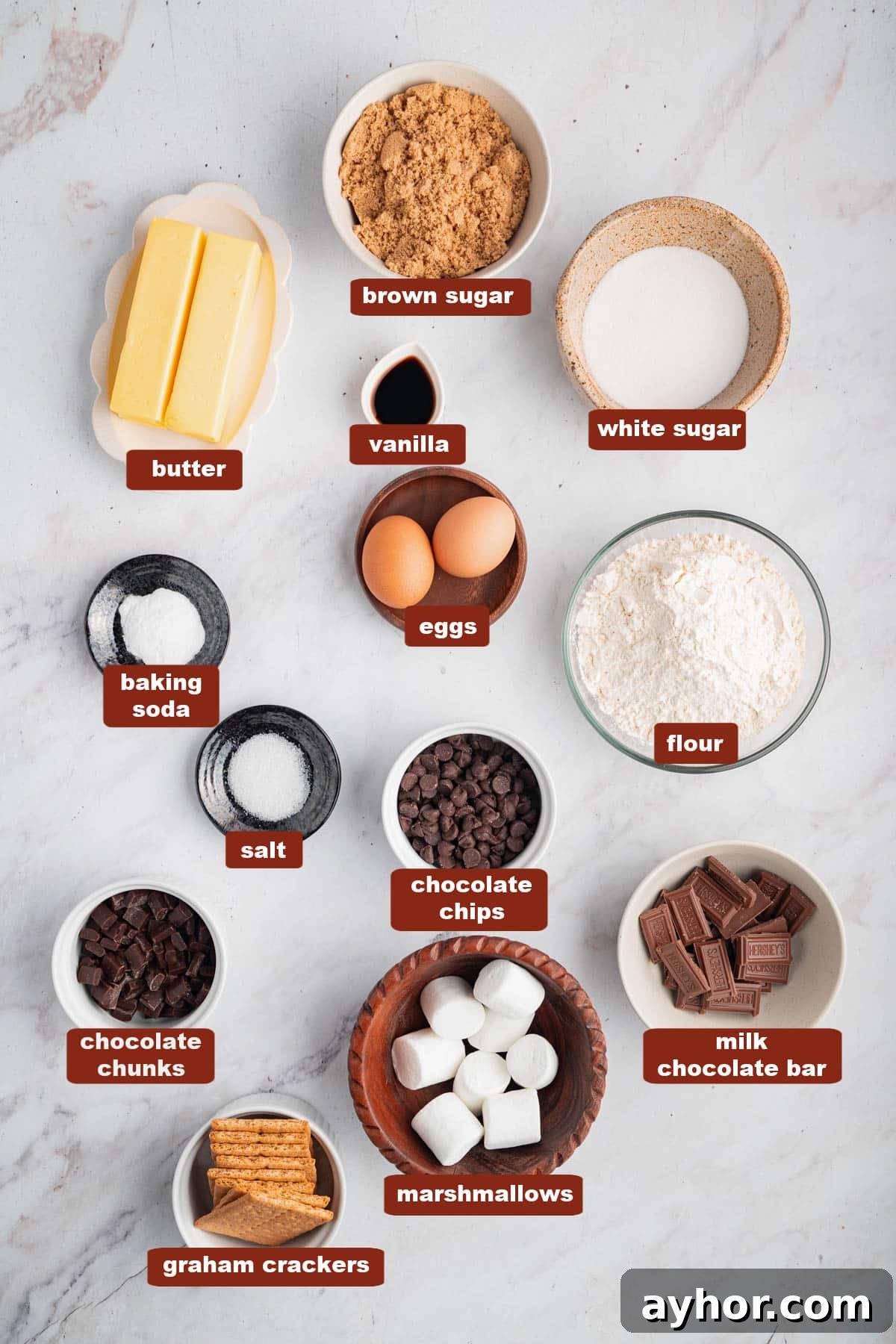 Ultimate S'mores Cookie Recipe: Crispy Edges & Gooey Centers 2 All of the ingredients for S'mores Cookies in bowls on a white countertop.