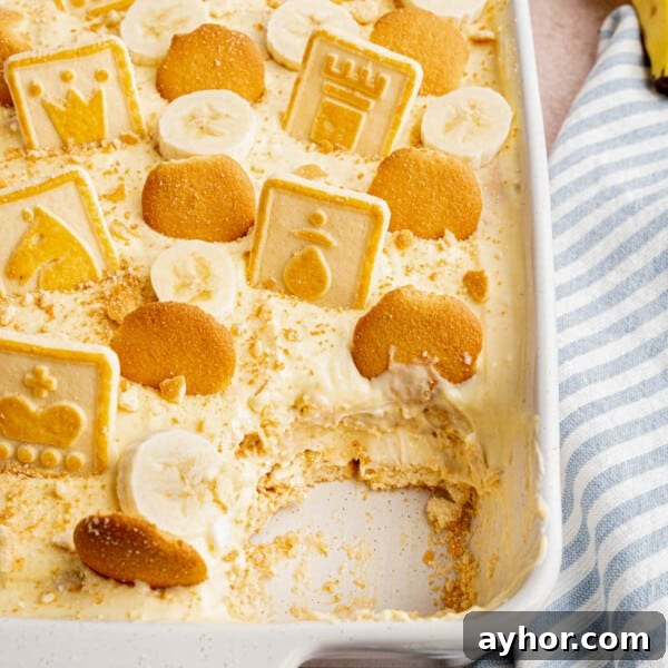 Ultimate S'mores Cookie Recipe: Crispy Edges & Gooey Centers 9 Homemade banana pudding in a white baking dish with a piece taken out after eating.