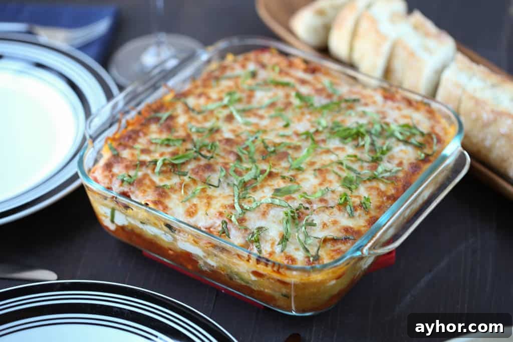 Spaghetti Squash Lasagna Recipe: Low-Carb Cheesy Layered Bake 4 spaghetti squash lasagna on a wooden table with bread and plates.