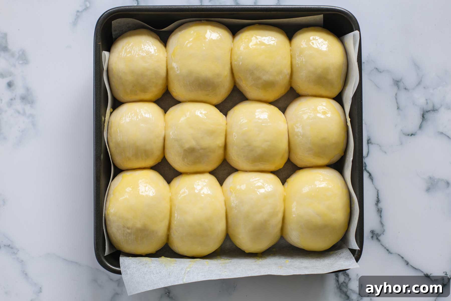 Rolls topped with the egg wash.