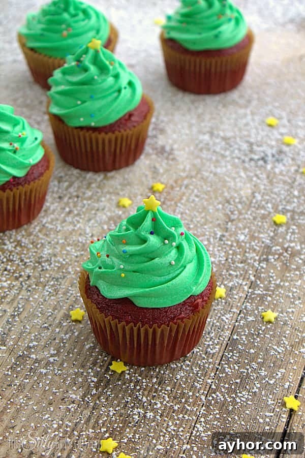 Christmas Tree Frosted Cupcakes, easy and super cute technique for a festive holiday treat! - ThisSillyGirlsLife.com #ChristmasTreeCupcakes Christmas Tree Frosted Cupcakes, easy and super cute technique for a festive holiday treat! - ThisSillyGirlsLife.com #ChristmasTreeCupcakes