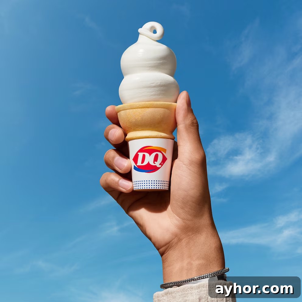 Hand holding a Dairy Queen Ice Cream Cone