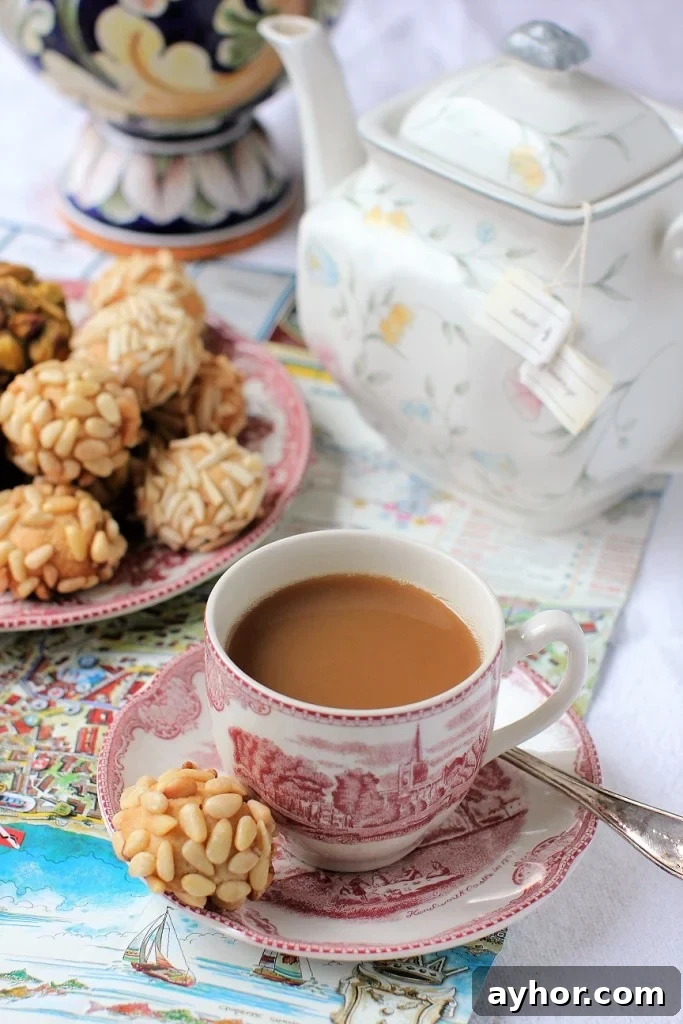 Savor Sicilian Almond Cookies While People Watching in Italy 2 cup of tea and a Sicilian Almond Cookie