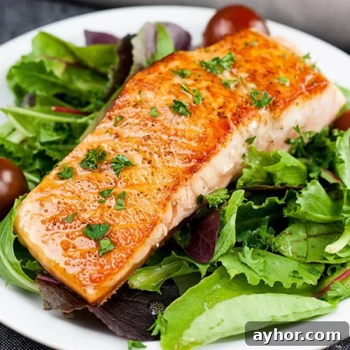 Pan seared salmon on salad.