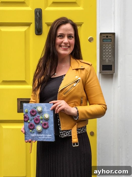 Katherine Hackworthy (aka Veggie Desserts) holding her debut cookbook
