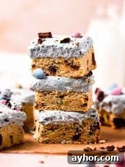 stack of mini egg cookie bars with cream cheese frosting