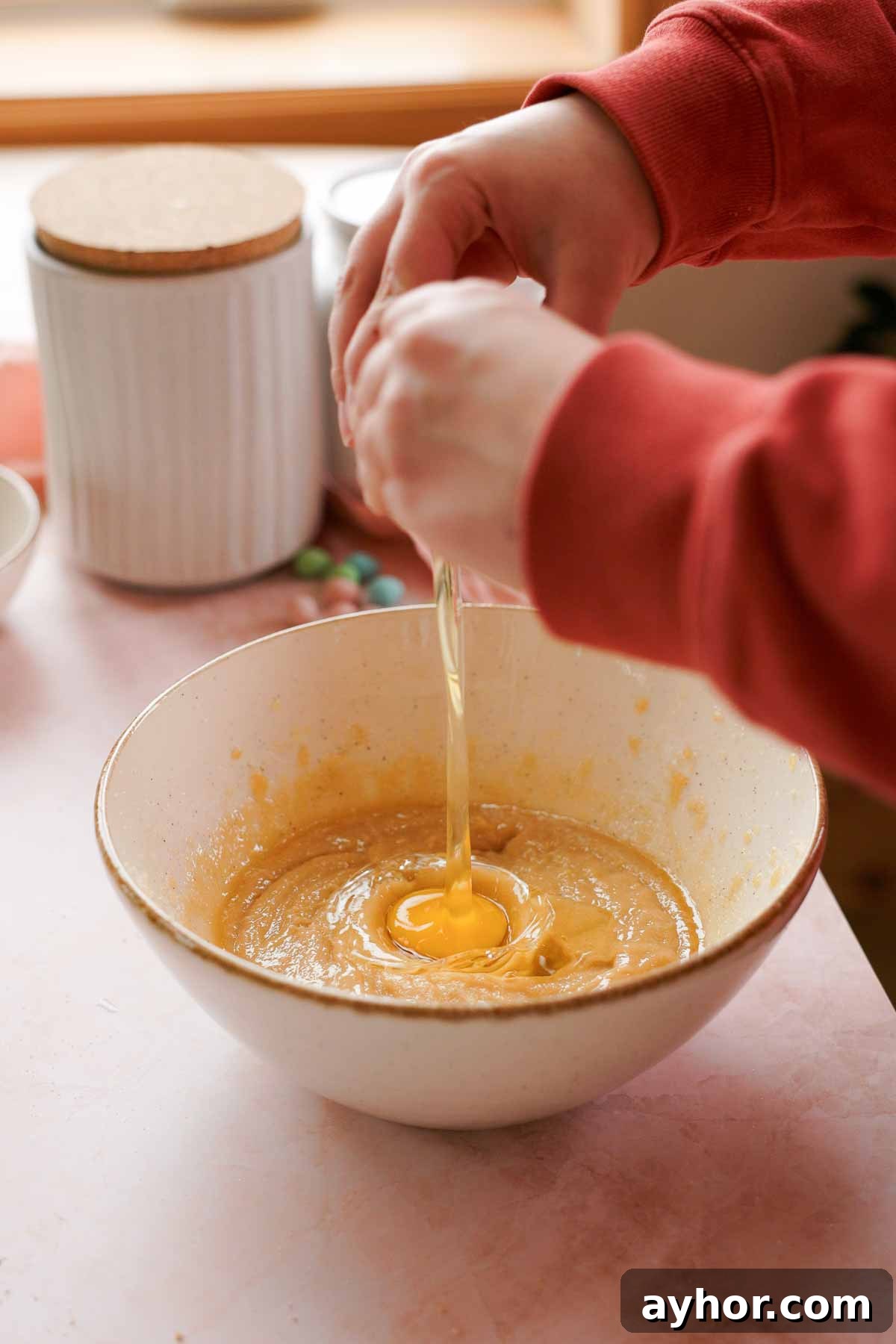 Mini Egg Cookies Recipe: Soft Cookies with Candy Eggs 4 adding egg to mini egg cookie dough wet ingredients