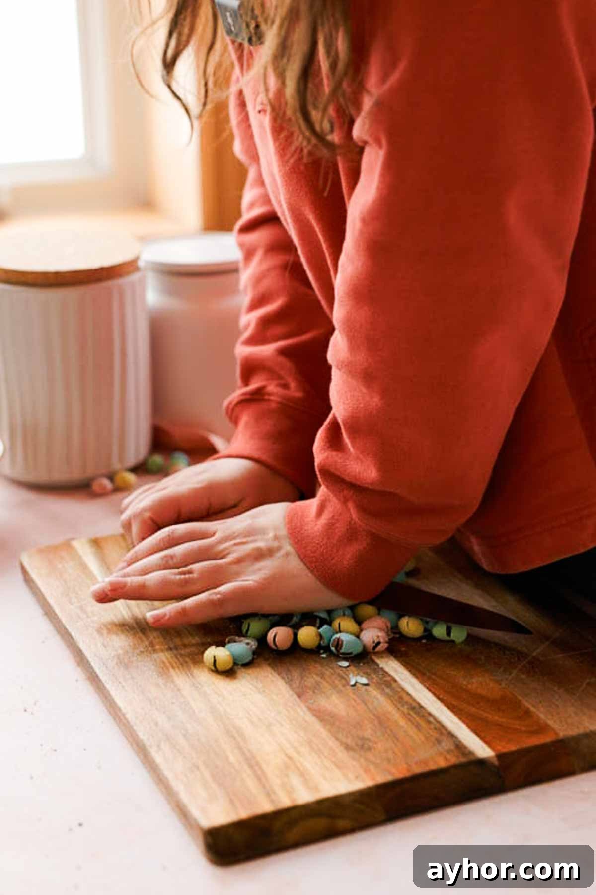 Mini Egg Cookies Recipe: Soft Cookies with Candy Eggs 6 crushing mini eggs with flat edge of the knife on a cutting board