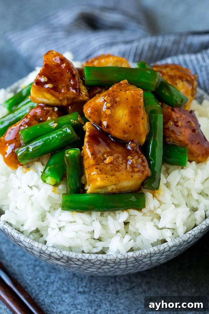 Chicken and green bean stir fry served over rice.