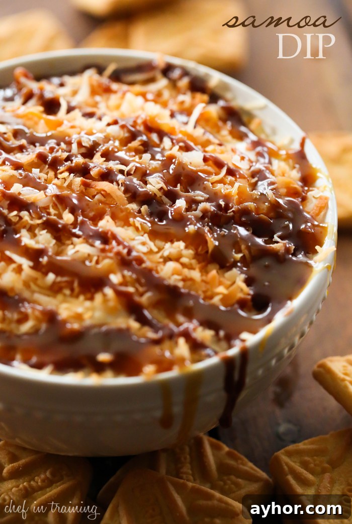 Samoa Dip inspired by Girl Scout Samoa cookies: cream cheese and cool whip base topped with toasted coconut and drizzled with caramel and chocolate