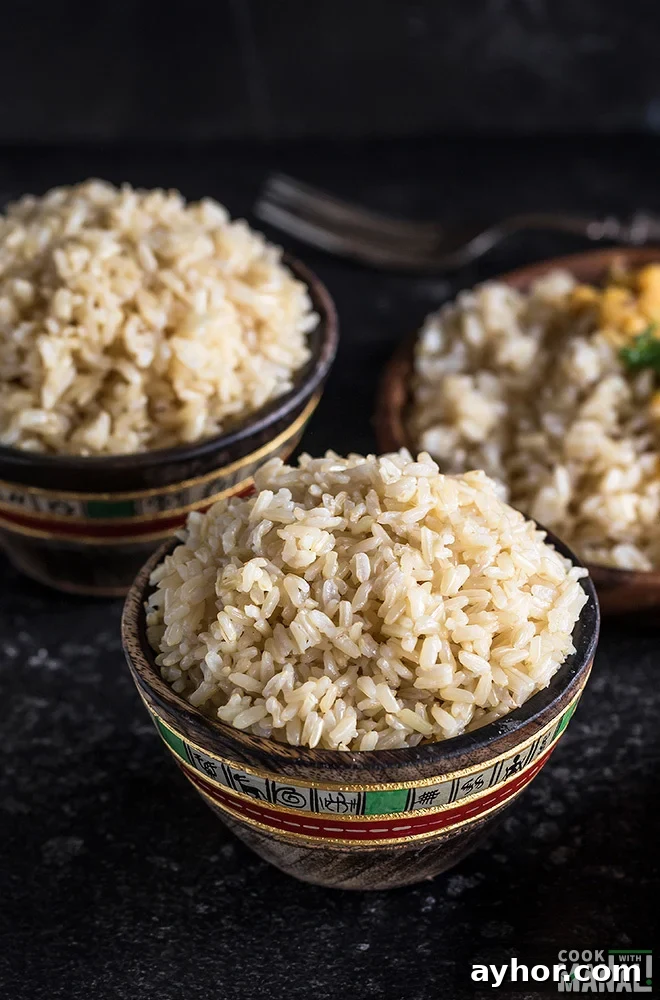 Fluffy Instant Pot Brown Rice in 20 Minutes 3 brown rice served in a small wooden bowl