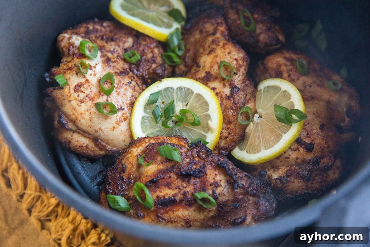 Crispy Mediterranean Chicken Thighs in the Air Fryer 3 Mediterranean chicken in an air fryer, ready to eat.