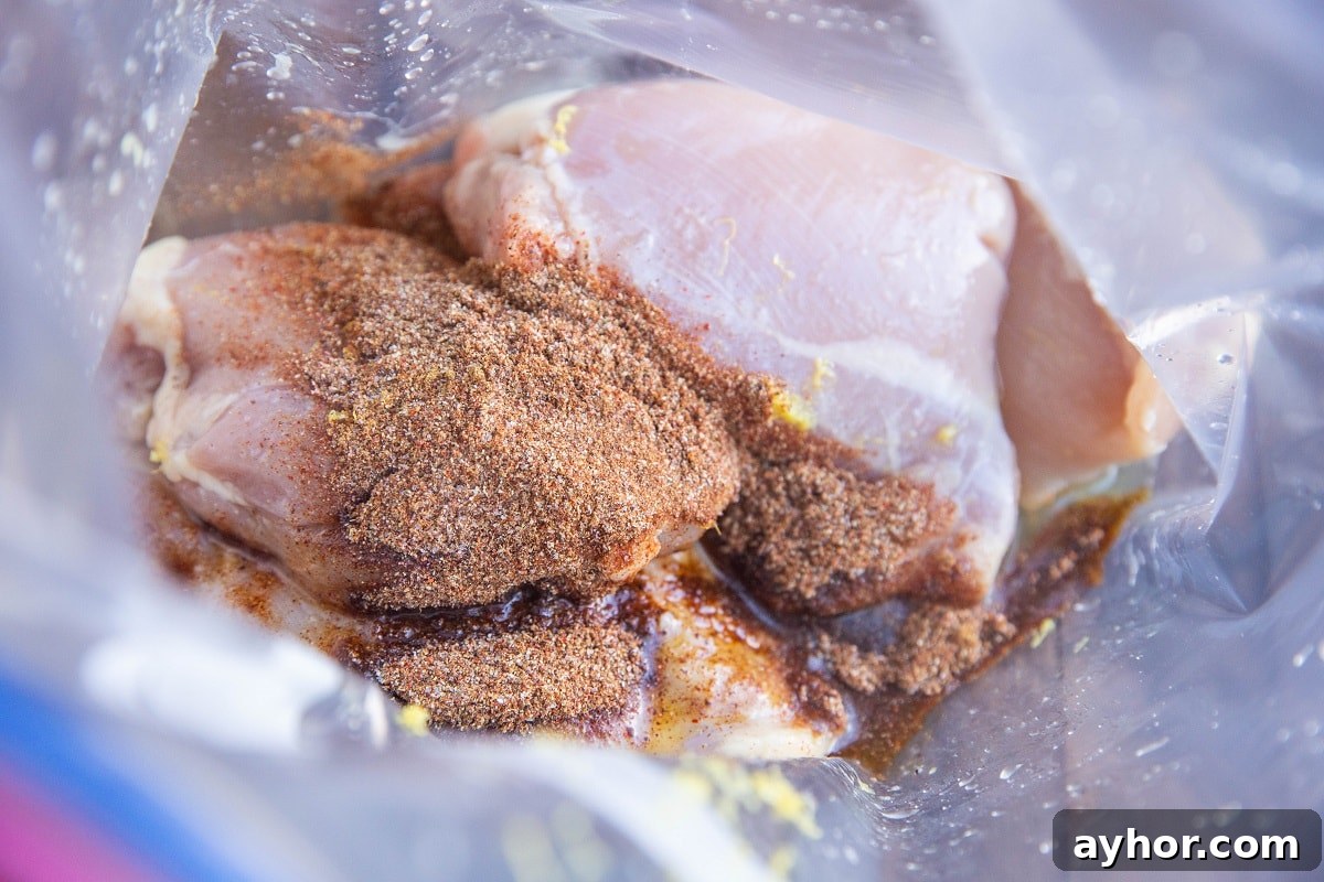 Crispy Mediterranean Chicken Thighs in the Air Fryer 5 Chicken thighs, lemon juice, lemon zest, oil, and seasonings in a zip lock bag to be marinated.