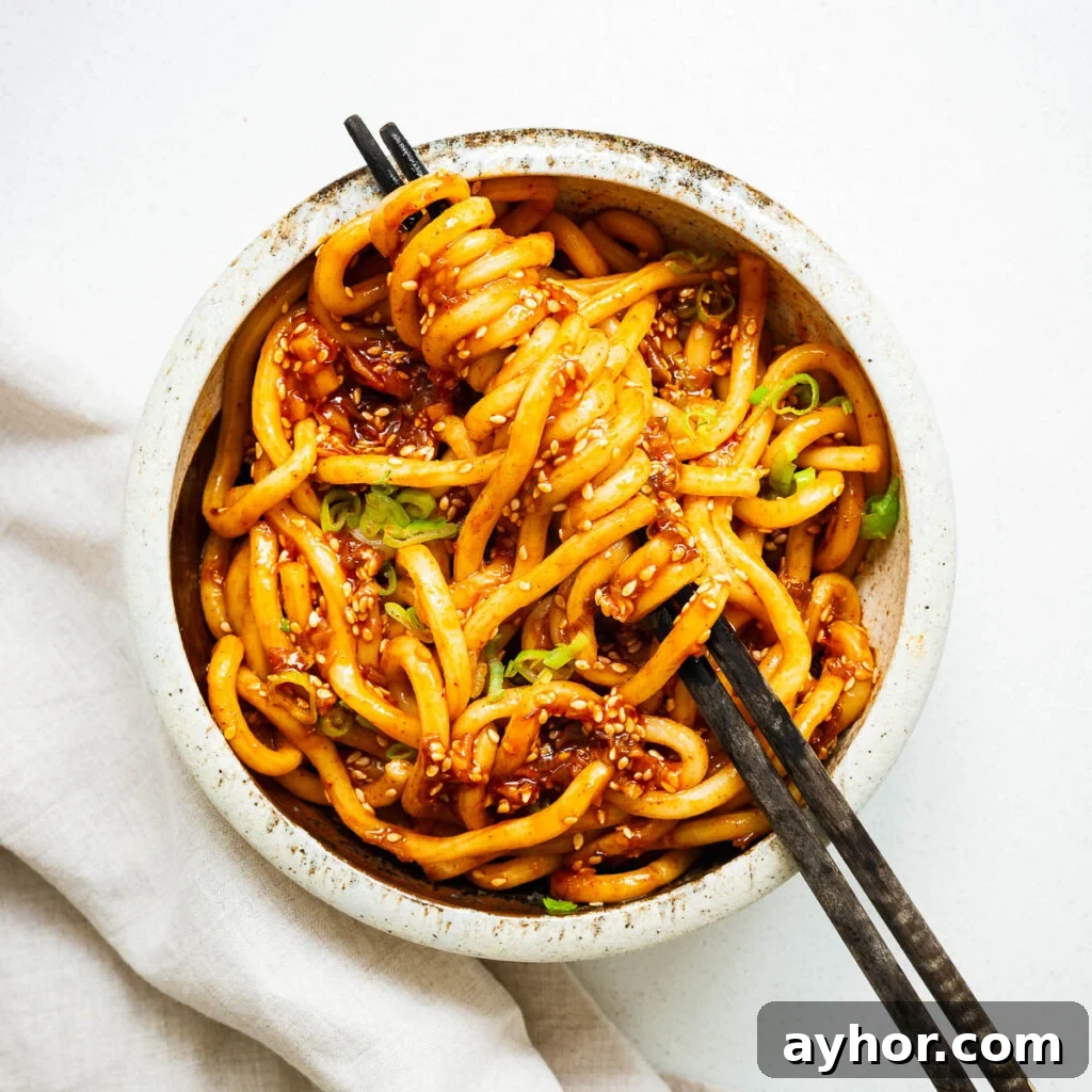 Gochujang Braised Tofu: Spicy Korean Tofu Recipe 11 A bowl of udon noodles with a spicy gochujang noodle sauce.