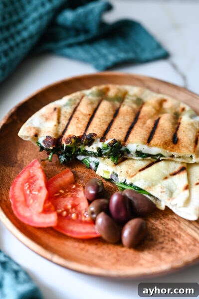 Crisp Spanakopita Made with Store Bought Phyllo 17 Spinach and cheese pita pocket full of spinach, feta and mozzarella.