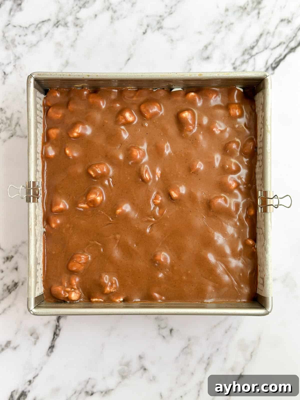brownies topped with chocolate frosting.