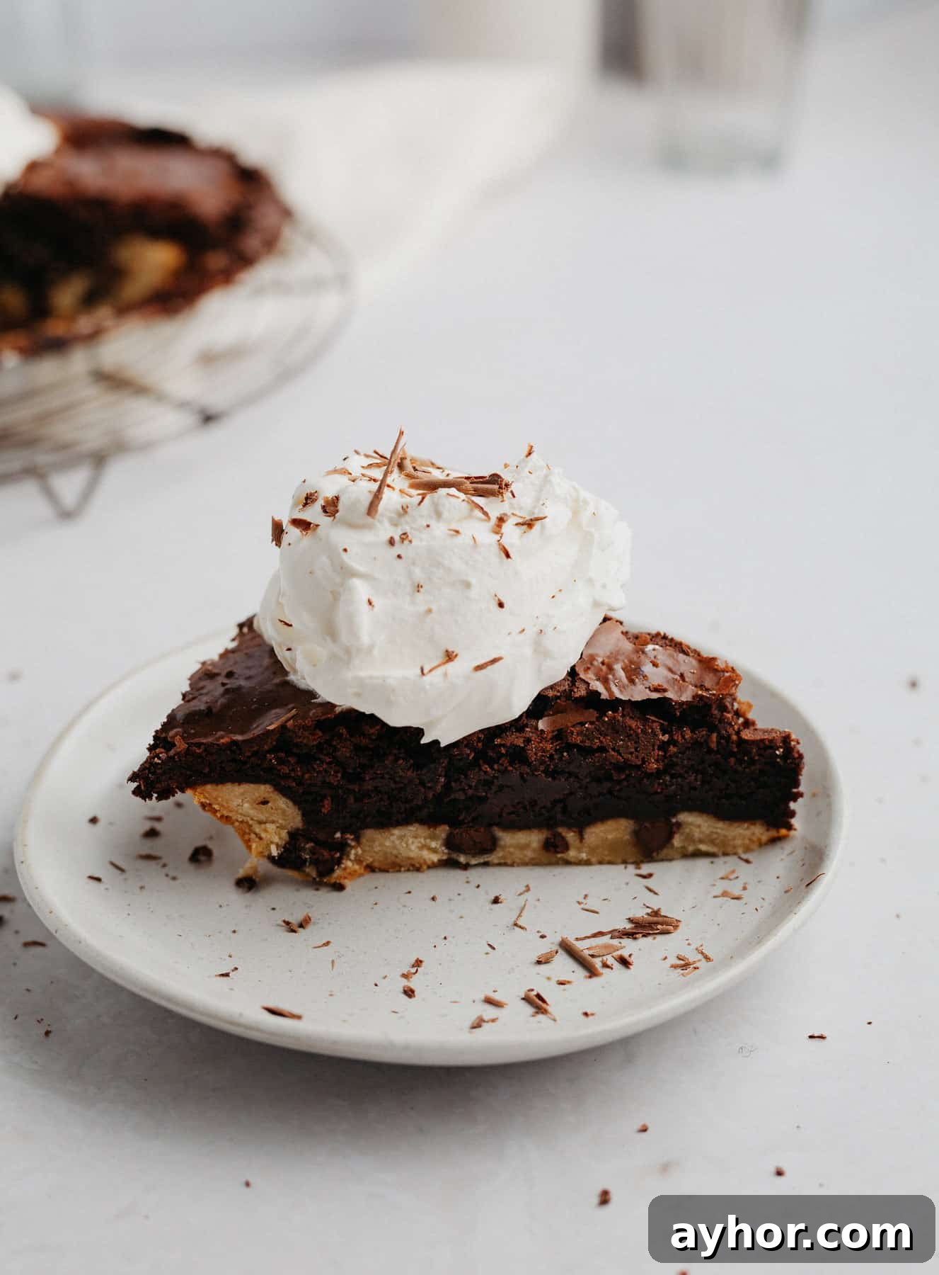 Decadent Chocolate Brownie Pie Recipe 2 A slice of brownie pie with a dollop of whipped cream