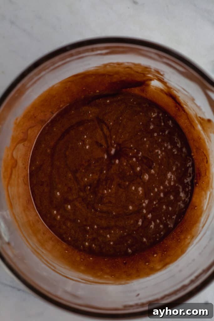 Decadent Chocolate Brownie Pie Recipe 15 brownie batter in a glass bowl