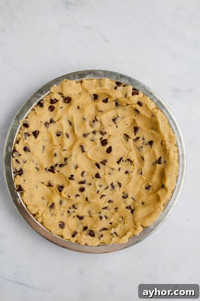 Decadent Chocolate Brownie Pie Recipe 10 A pie plate with unbaked chocolate chip cookie crust