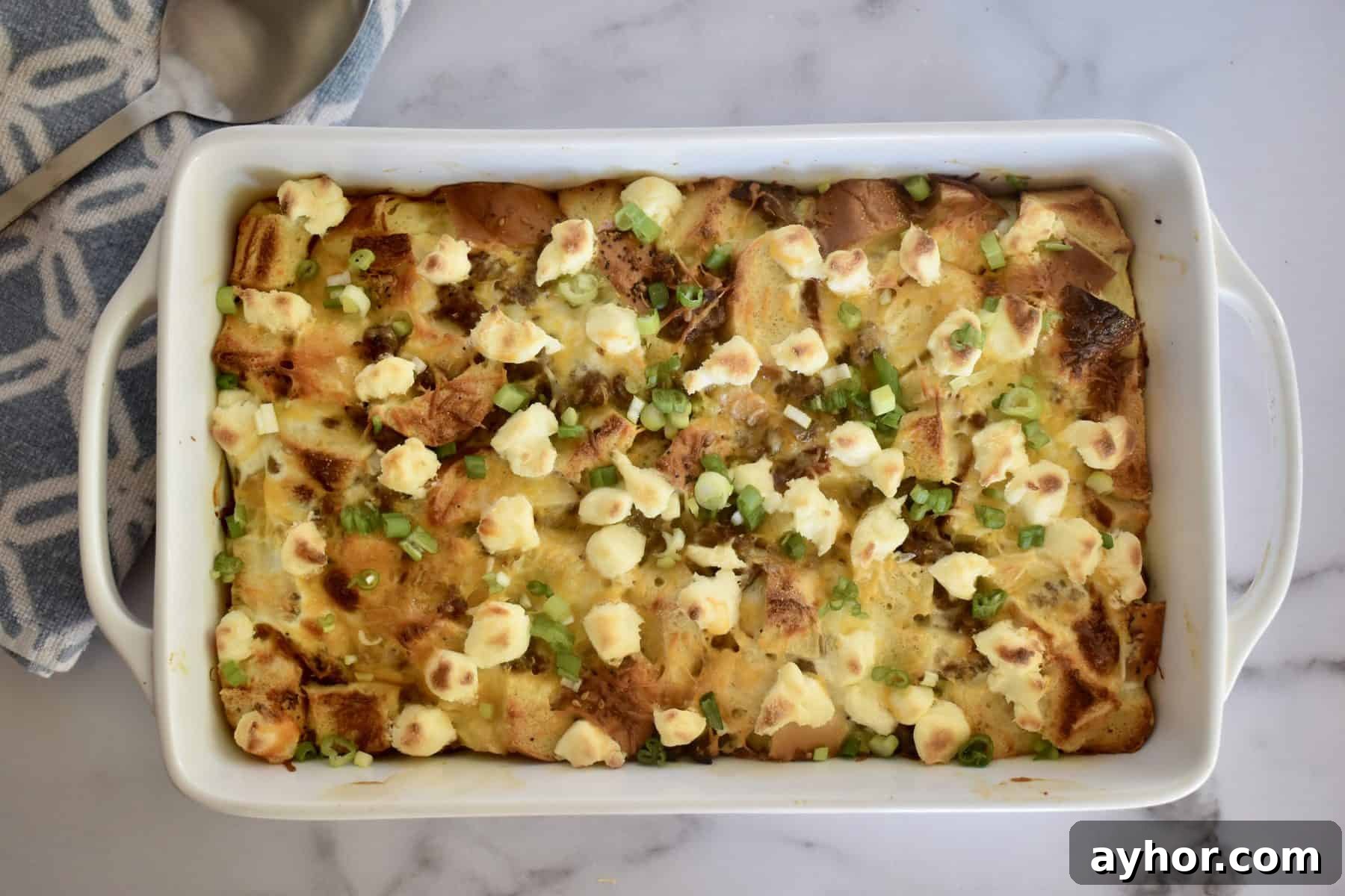 Everything Bagel Sausage Breakfast Bake 3 Everything Bagel Sausage Bake in a white casserole dish.
