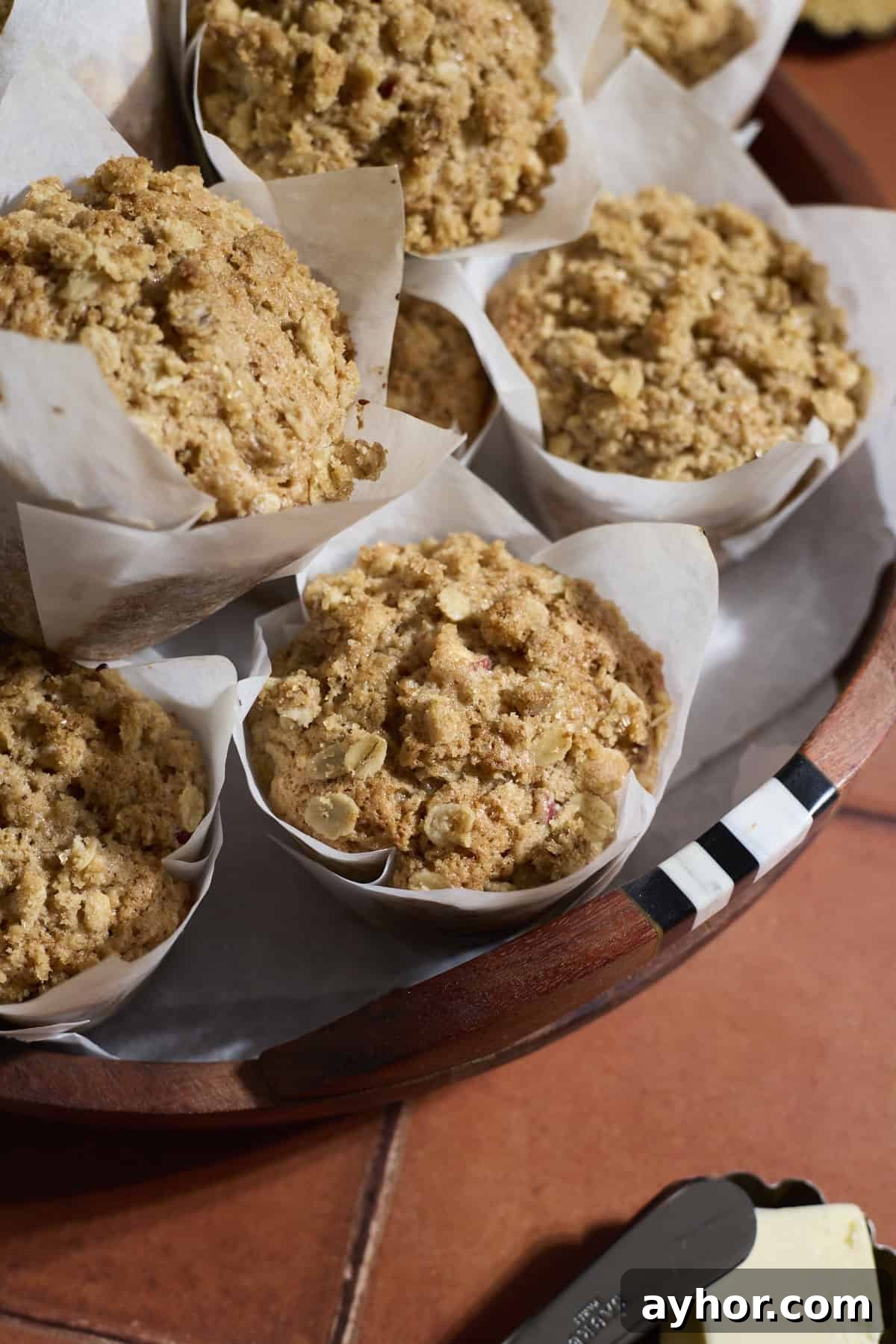 Sourdough Apple Muffins on a wooden tray.