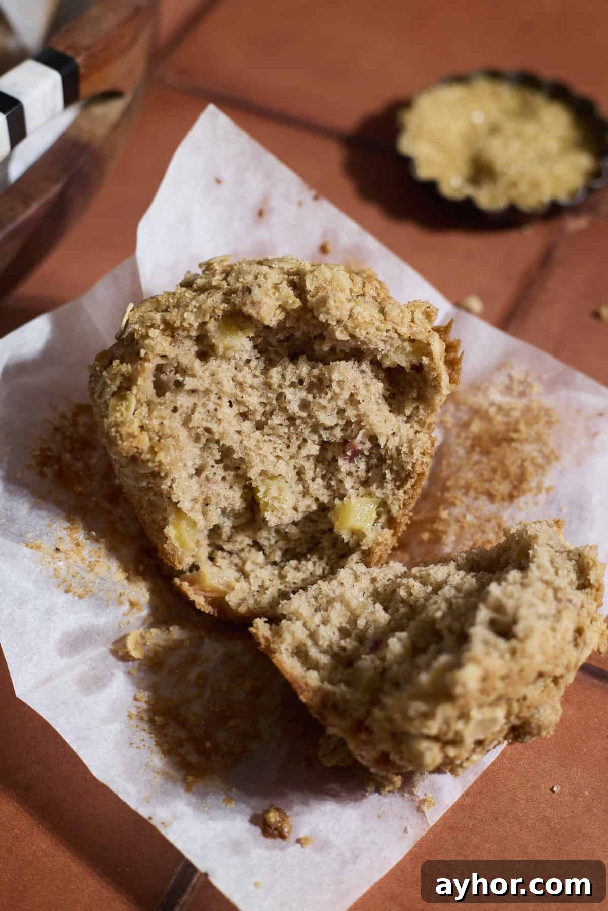 A muffin torn in half to show the interior texture.